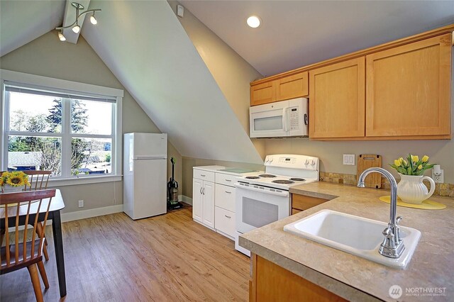 656 Lehman Dr, Camano Island, WA 98282 - kitchen featuring white appliances, lofted ceiling, light wood finished floors, light countertops, and recessed lighting