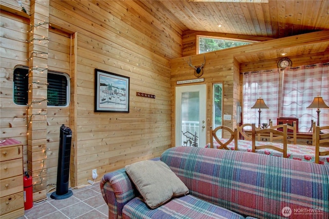 44664 Similk Trl, Concrete, WA 98237 - living area with wood walls, lofted ceiling, wood ceiling, and tile patterned floors