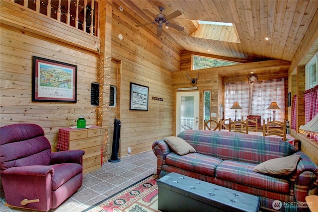 44664 Similk Trl, Concrete, WA 98237 - living area with wood walls, wooden ceiling, a skylight, a ceiling fan, and high vaulted ceiling