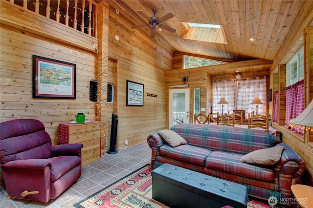 44664 Similk Trl, Concrete, WA 98237 - tiled living area with wooden walls, wooden ceiling, a skylight, a ceiling fan, and high vaulted ceiling