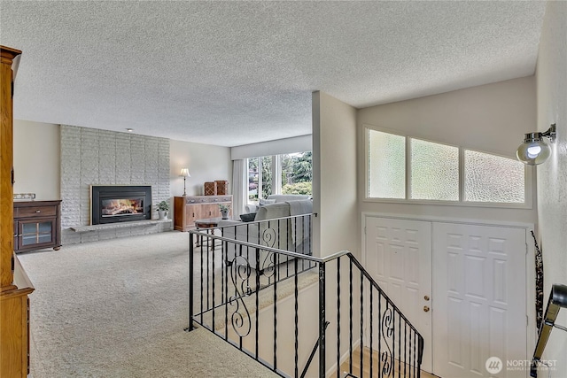1728 N James St, Tacoma, WA 98406 - corridor with an upstairs landing, carpet floors, and a textured ceiling