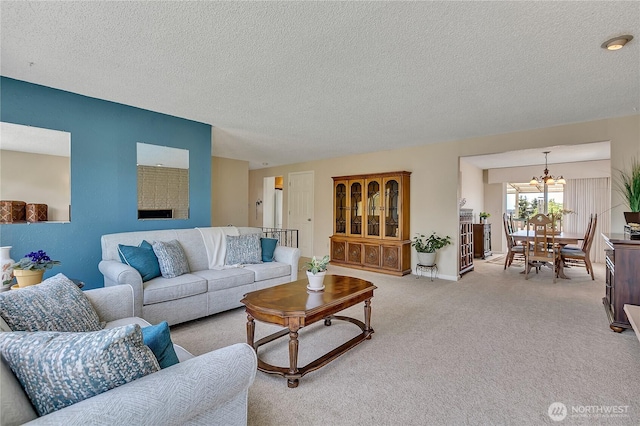 1728 N James St, Tacoma, WA 98406 - living area featuring a textured ceiling, a chandelier, and carpet floors