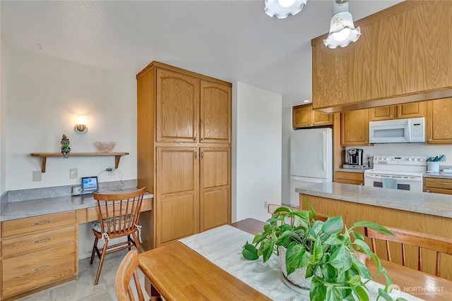1728 N James St, Tacoma, WA 98406 - kitchen featuring white appliances, built in study area, light countertops, brown cabinetry, and open shelves