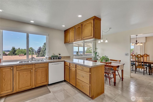 1728 N James St, Tacoma, WA 98406 - kitchen with dishwasher, a peninsula, a chandelier, recessed lighting, and light countertops