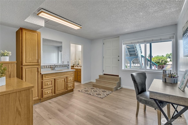 1728 N James St, Tacoma, WA 98406 - home office with light wood-style floors and a textured ceiling