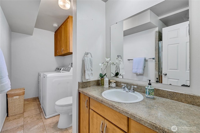 1728 N James St, Tacoma, WA 98406 - bathroom featuring washer and clothes dryer, vanity, and tile patterned flooring