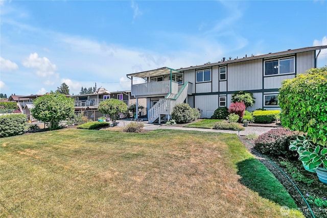 1728 N James St, Tacoma, WA 98406 - rear view of house featuring stairway and a lawn