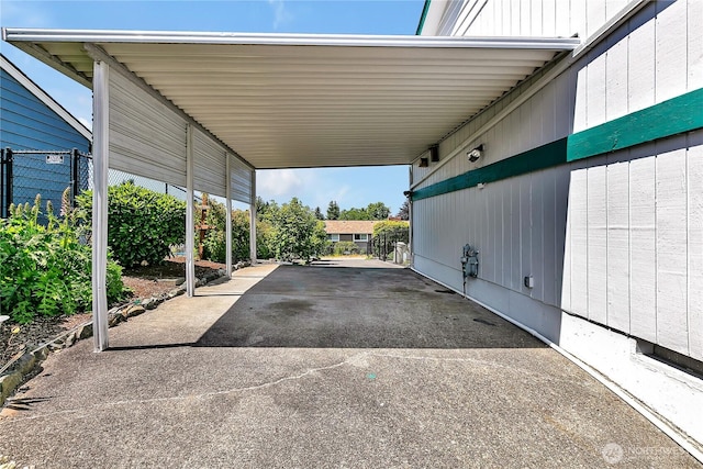1728 N James St, Tacoma, WA 98406 - view of parking with an attached carport and asphalt driveway