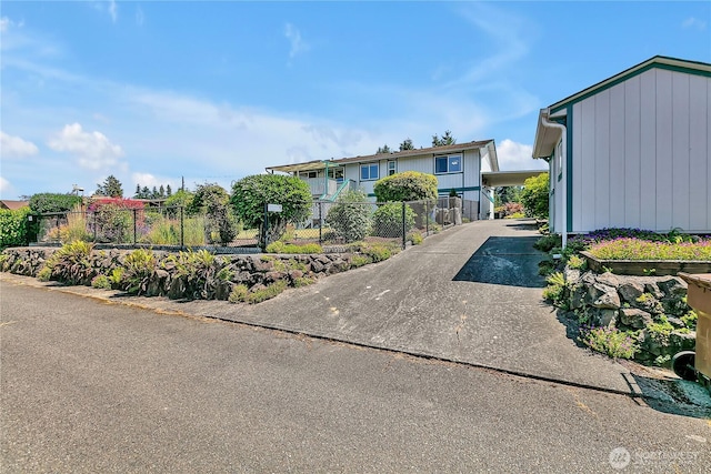 1728 N James St, Tacoma, WA 98406 - view of front of house featuring concrete driveway and an attached carport