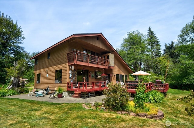 13273 W Cloquallum Rd, Elma, WA 98541 - rear view of property featuring a balcony, a patio, a lawn, and a wooden deck