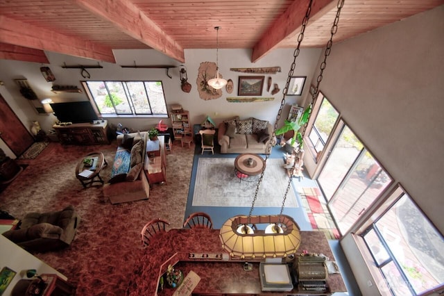13273 W Cloquallum Rd, Elma, WA 98541 - carpeted living room featuring a wooden ceiling with exposed beams