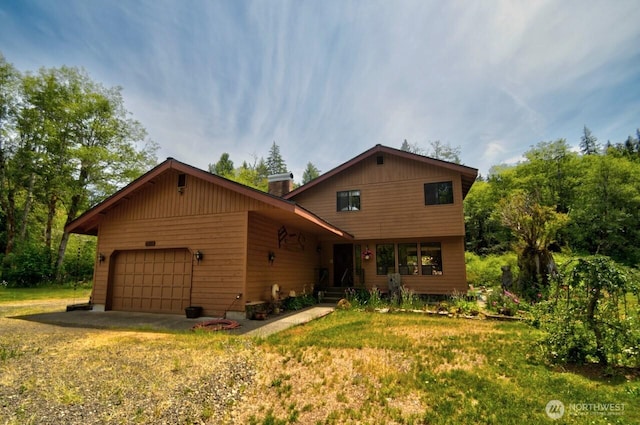 13273 W Cloquallum Rd, Elma, WA 98541 - view of front of home with a garage and a chimney