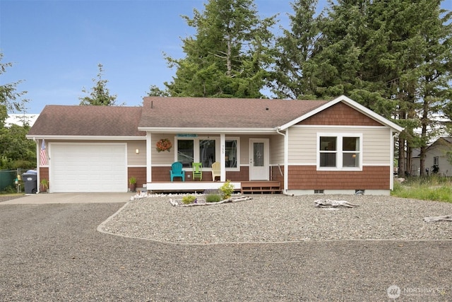 755 Island Cir SE, Ocean Shores, WA 98569 - ranch-style house with a porch, a garage, asphalt driveway, and a shingled roof