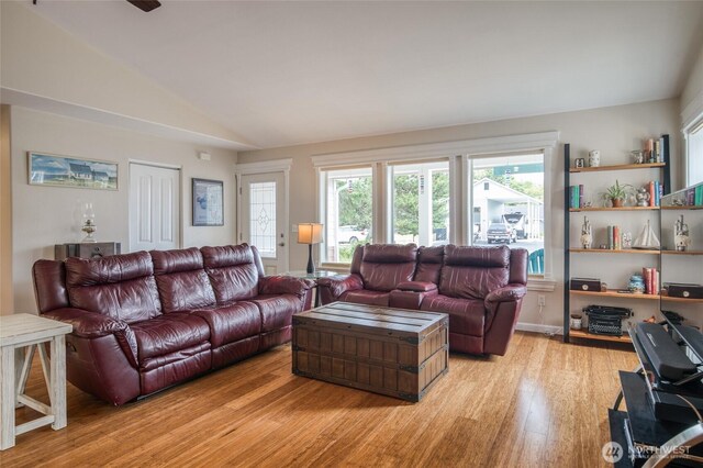 755 Island Cir SE, Ocean Shores, WA 98569 - living area with light wood-style flooring and vaulted ceiling