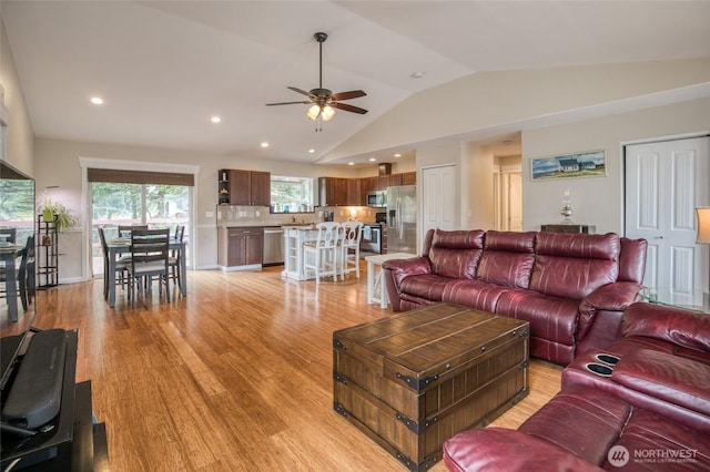 755 Island Cir SE, Ocean Shores, WA 98569 - living room featuring ceiling fan, vaulted ceiling, light wood-type flooring, and recessed lighting