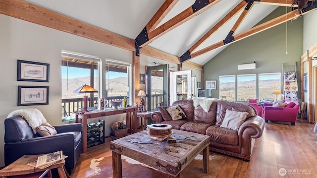 767 Bill Shaw Rd, Pateros, WA 98846 - living area with beam ceiling, high vaulted ceiling, wood finished floors, and a mountain view