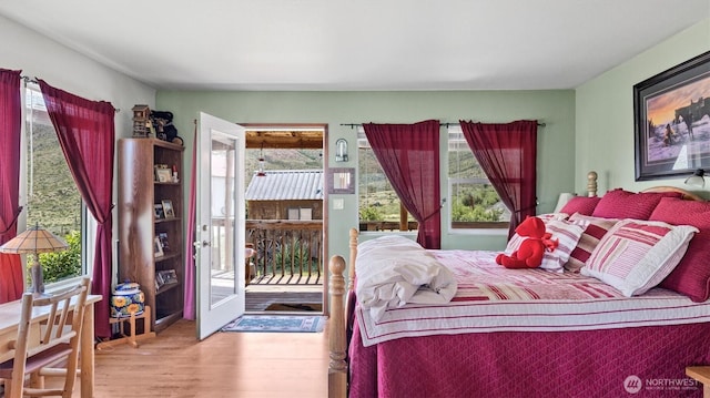 767 Bill Shaw Rd, Pateros, WA 98846 - bedroom featuring wood finished floors and access to exterior
