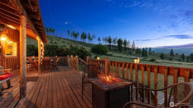 767 Bill Shaw Rd, Pateros, WA 98846 - wooden terrace with a fire pit, outdoor dining area, and a mountain view