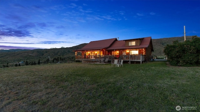 767 Bill Shaw Rd, Pateros, WA 98846 - rear view of property with a lawn, a metal roof, and a mountain view