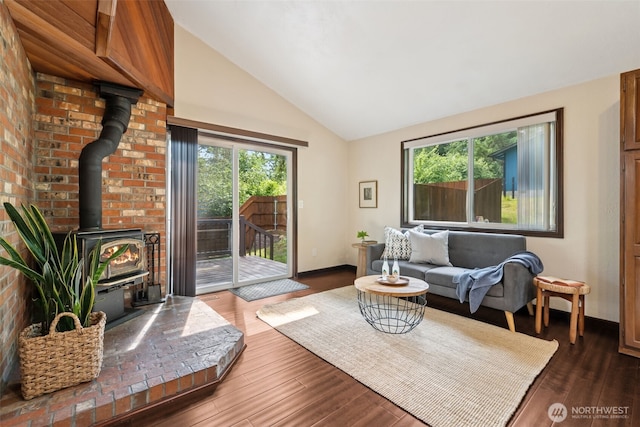 8037 Incline Dr SE, Olympia, WA 98513 - living room with a wood stove, dark wood finished floors, and high vaulted ceiling