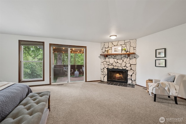 8037 Incline Dr SE, Olympia, WA 98513 - carpeted living area with a stone fireplace and baseboards