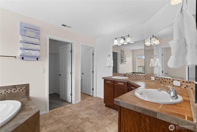 18328 73rd Avenue Ct E, Puyallup, WA 98375 - bathroom with double vanity and a garden tub