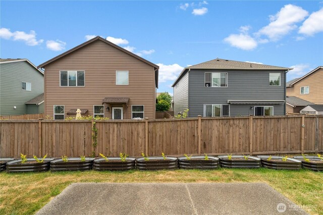 18328 73rd Avenue Ct E, Puyallup, WA 98375 - back of house with a fenced backyard