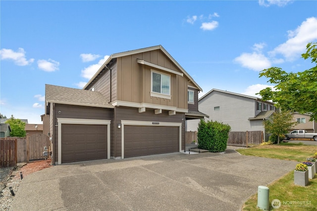18328 73rd Avenue Ct E, Puyallup, WA 98375 - view of front of property with board and batten siding, driveway, and a garage