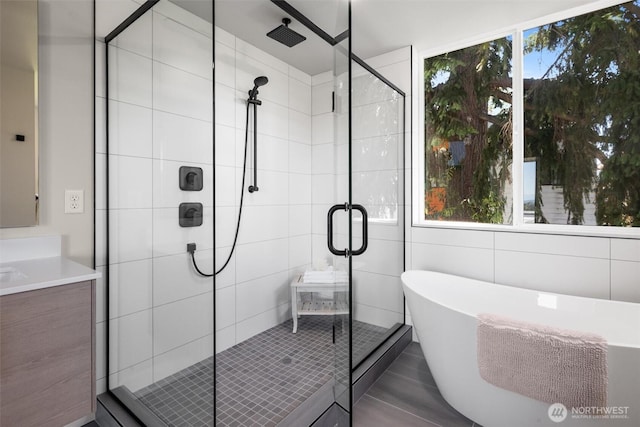 1313 14th Ave S Unit B, Seattle, WA 98144 - full bathroom featuring a shower stall, a soaking tub, and vanity