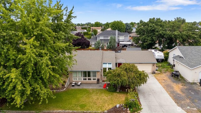 9307 Albert Way SE, Moses Lake, WA 98837 - aerial perspective of suburban area with a tree filled landscape