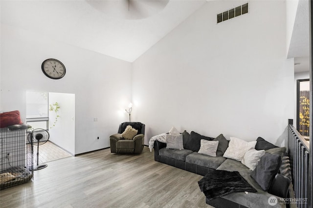 9307 Albert Way SE, Moses Lake, WA 98837 - living room featuring high vaulted ceiling, a ceiling fan, and wood finished floors