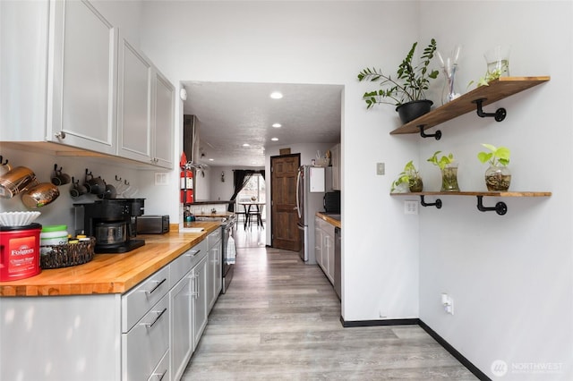 9307 Albert Way SE, Moses Lake, WA 98837 - kitchen featuring butcher block countertops, freestanding refrigerator, open shelves, light wood-type flooring, and recessed lighting