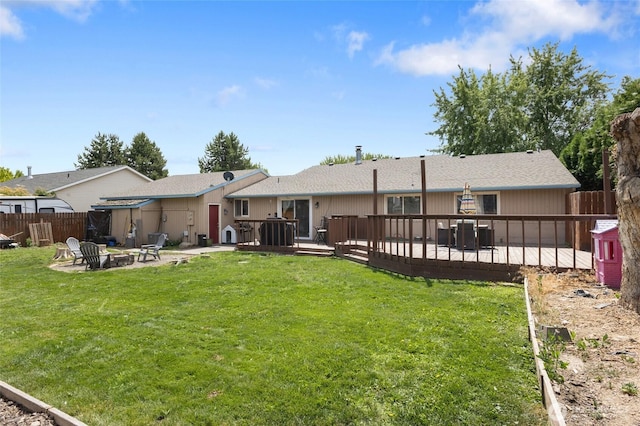 9307 Albert Way SE, Moses Lake, WA 98837 - back of house featuring a fire pit, a wooden deck, and a patio area