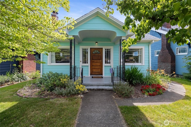 4335 Fawcett Ave, Tacoma, WA 98418 - view of front facade featuring a front lawn
