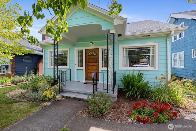 4335 Fawcett Ave, Tacoma, WA 98418 - view of front of property with a shingled roof and covered porch