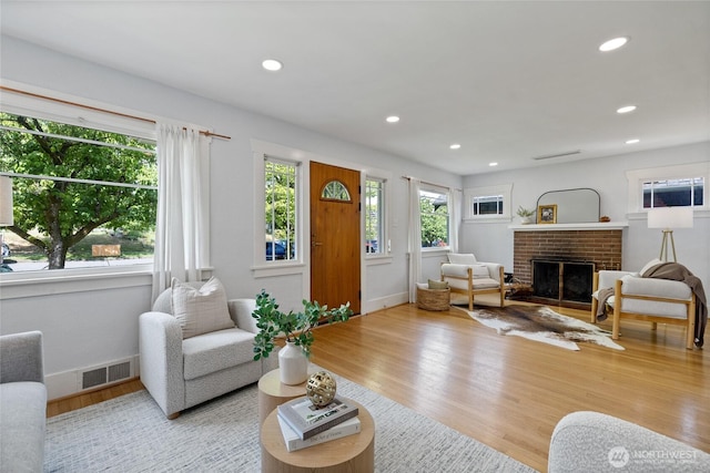4335 Fawcett Ave, Tacoma, WA 98418 - living room featuring a brick fireplace, wood finished floors, and recessed lighting