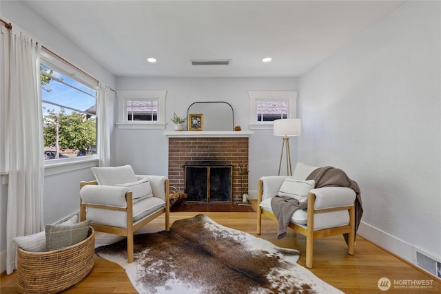 4335 Fawcett Ave, Tacoma, WA 98418 - living area featuring a fireplace, wood finished floors, and recessed lighting