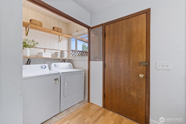 4335 Fawcett Ave, Tacoma, WA 98418 - laundry room with washing machine and dryer and light wood-type flooring