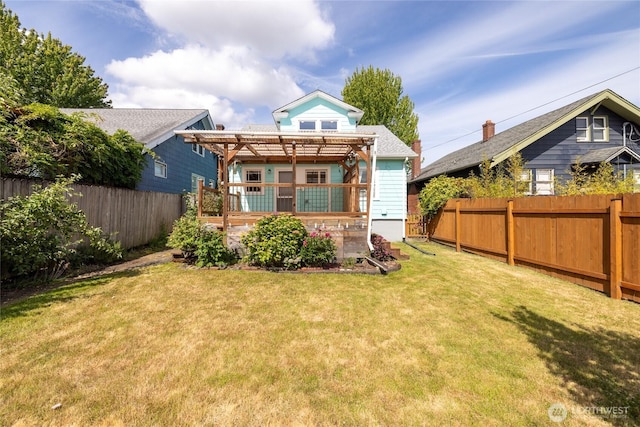 4335 Fawcett Ave, Tacoma, WA 98418 - back of property with a pergola, a fenced backyard, and a wooden deck