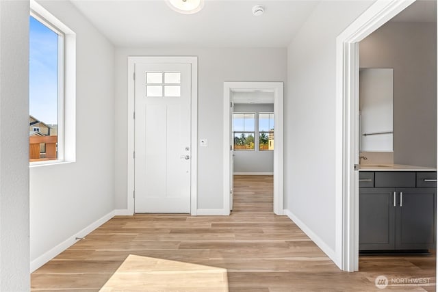 13936 178th St E Unit 85, Puyallup, WA 98374 - entryway featuring light wood-type flooring and baseboards