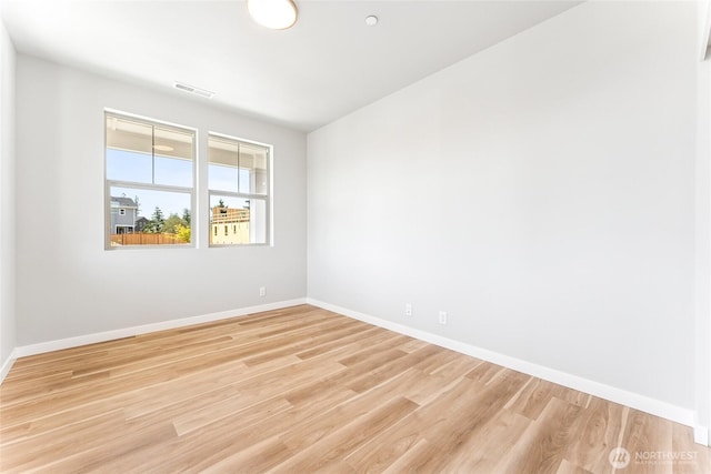 13936 178th St E Unit 85, Puyallup, WA 98374 - empty room featuring baseboards and light wood-type flooring