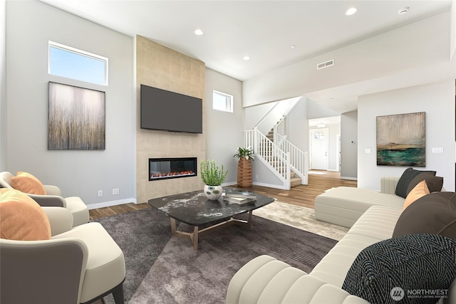 13936 178th St E Unit 85, Puyallup, WA 98374 - living room with stairs, a fireplace, recessed lighting, and wood finished floors