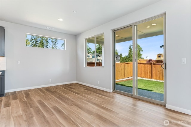 13936 178th St E Unit 85, Puyallup, WA 98374 - empty room featuring light wood-type flooring and recessed lighting