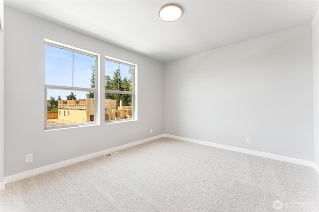 13936 178th St E Unit 85, Puyallup, WA 98374 - spare room with baseboards and carpet flooring