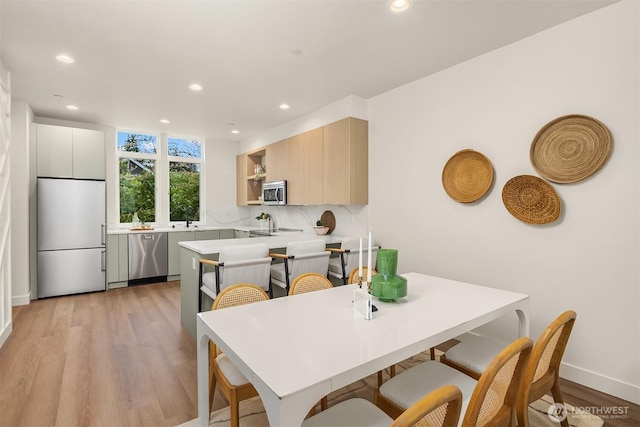 1615 N 50th St Unit A, Seattle, WA 98103 - dining room with light wood finished floors and recessed lighting
