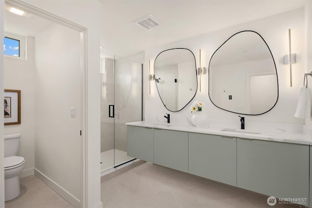 1615 N 50th St Unit A, Seattle, WA 98103 - bathroom featuring double vanity, a stall shower, and tile patterned floors
