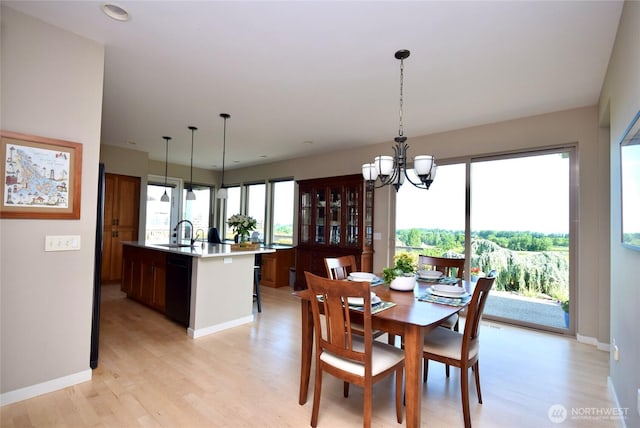 771 Brigadoon Blvd, Sequim, WA 98382 - dining area with light wood-style flooring, a chandelier, and recessed lighting