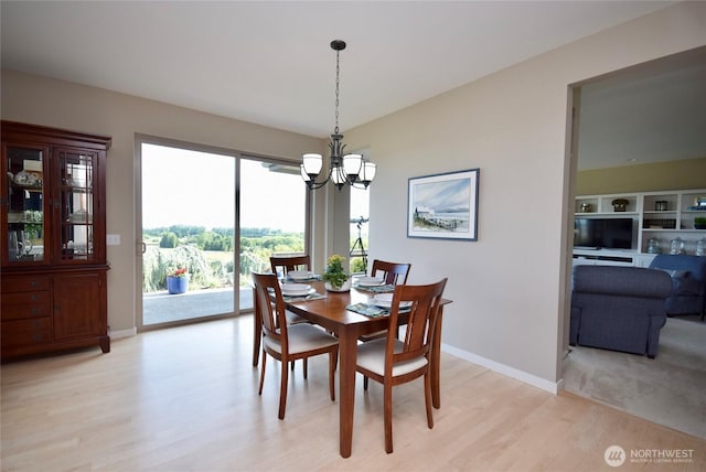 771 Brigadoon Blvd, Sequim, WA 98382 - dining room featuring a chandelier and light wood-style flooring