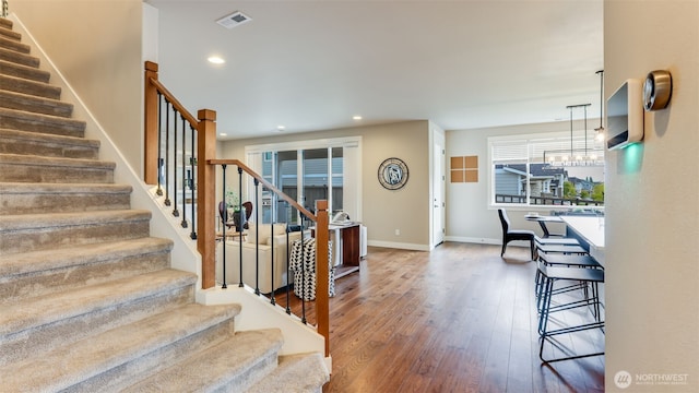 23000 SE Sycamore St, Black Diamond, WA 98010 - stairway with wood finished floors and recessed lighting