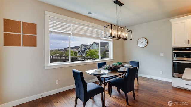 23000 SE Sycamore St, Black Diamond, WA 98010 - dining area with a chandelier and dark wood-style flooring